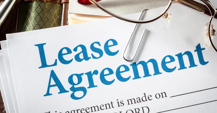 Close up of Lease Agreement Form with paper clip and glasses