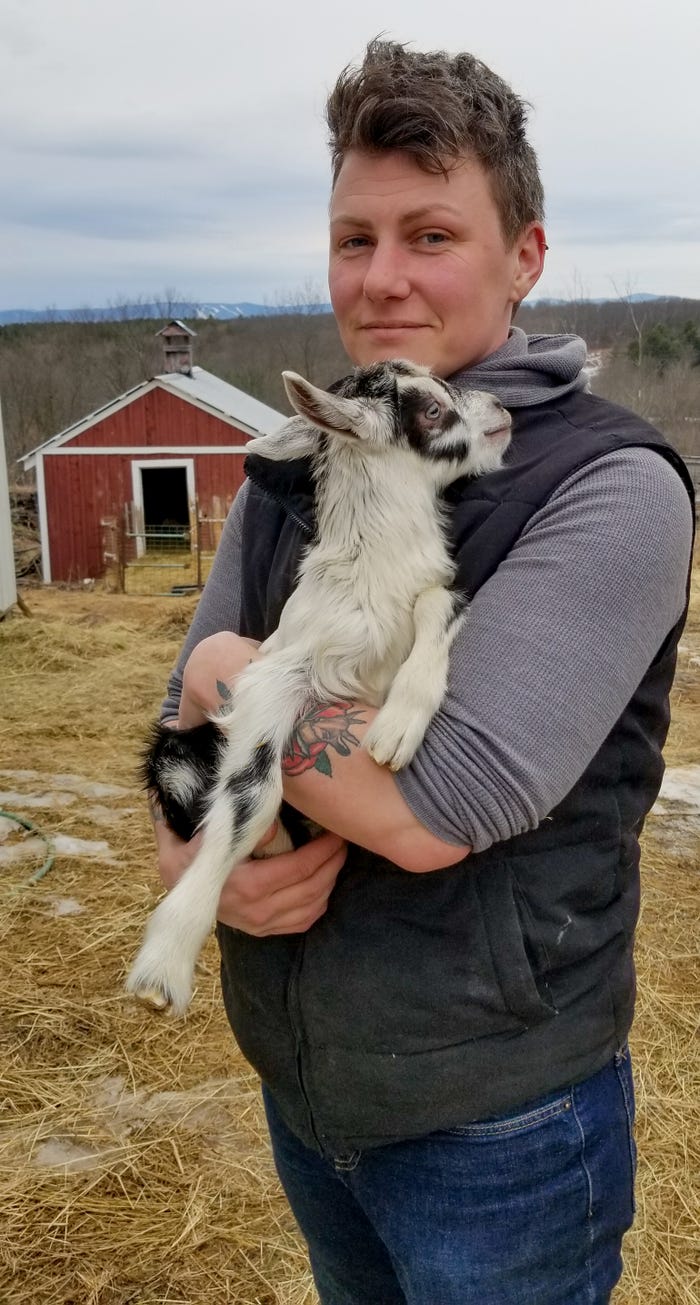 Lee Hennessey, owner of Moxie Ridge Farm & Creamery, holds a goat