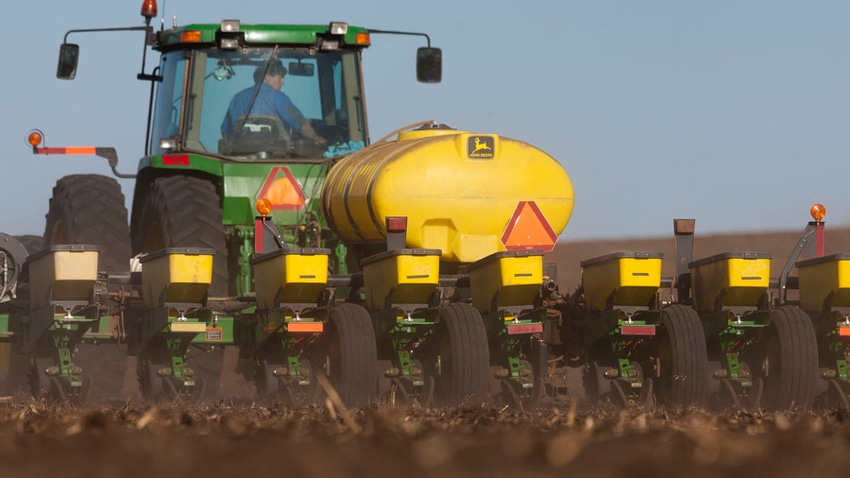 Tractor planting corn