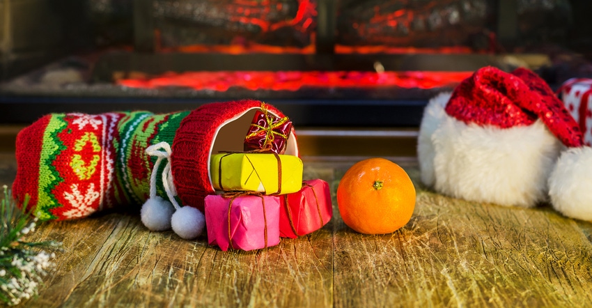 Christmas scene with orange coming out of stocking
