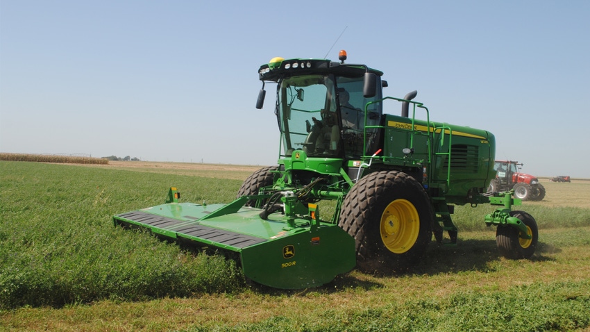 Tractor in alfalfa field Tractor in alfalfa field
