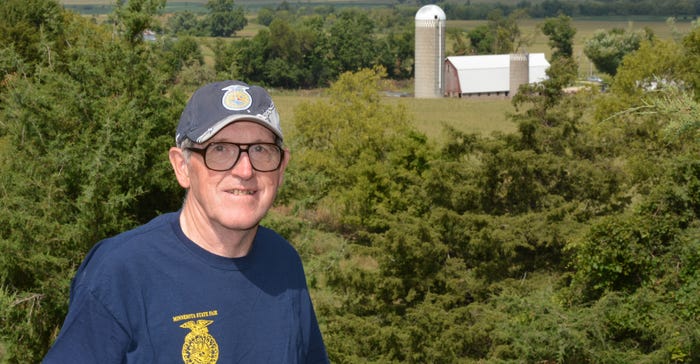 Ed Terry standing in front of the Tracy property 