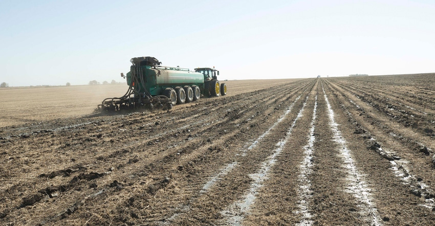 Manure application being applied in field