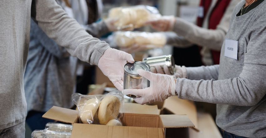 workers boxing food at food pantry