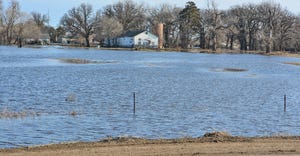 farmstead surrounded by floodwaters
