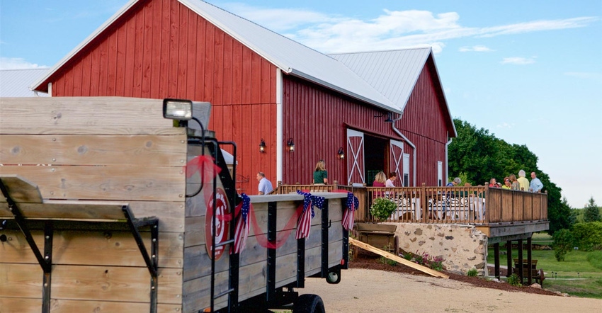 A barn with a balcony used for social gatherings and events