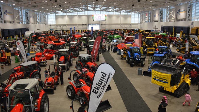 the Exposition Center floor filled with large machinery at the New York State Fairgrounds during the New York Farm Show