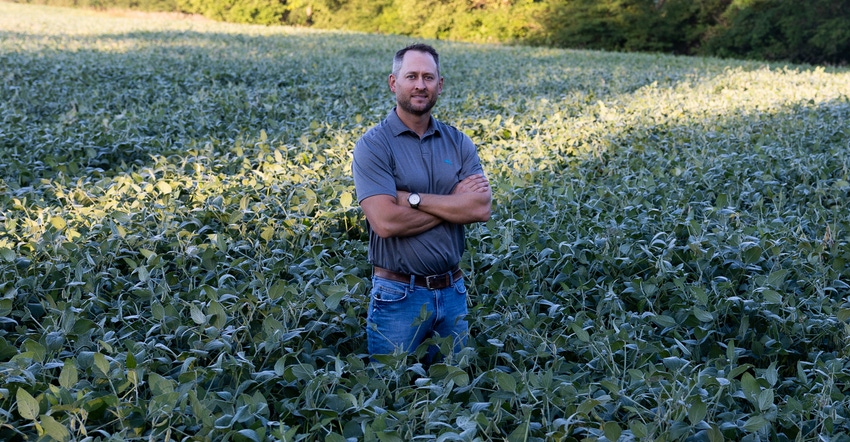 Joel Barickman smiles for the camera in his soybean field in Livingston County, Ill.