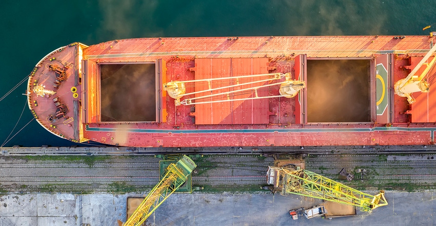 Top view from drone of a large ship loading grain for export. Water transport
