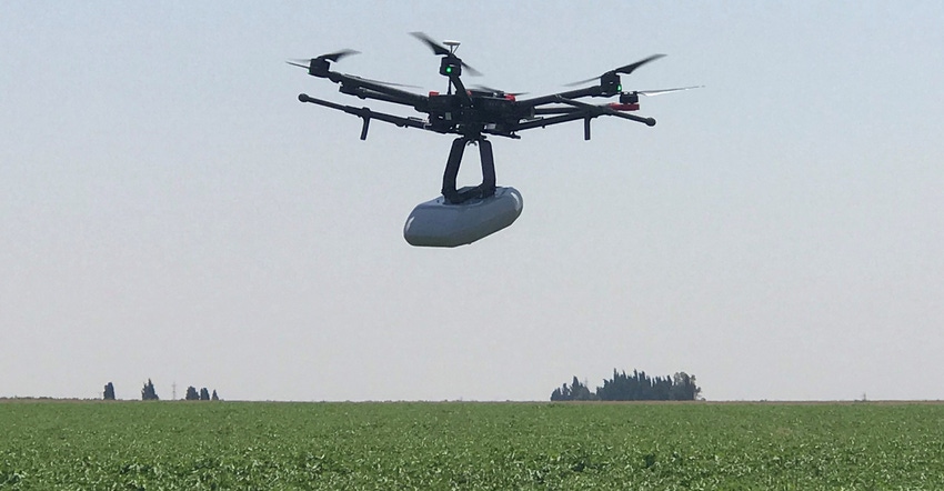 drone flying above field