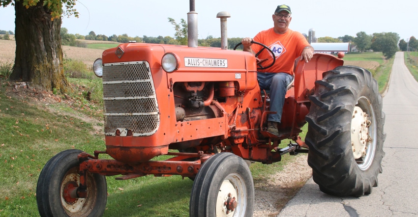 Jim Klink sitting on his row-crop tractor 