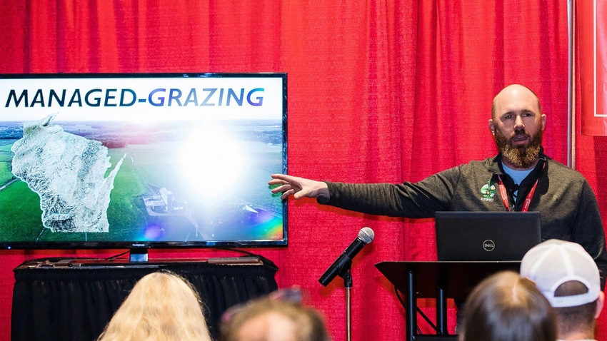 grazing outreach specialist talking to attendees of presentation