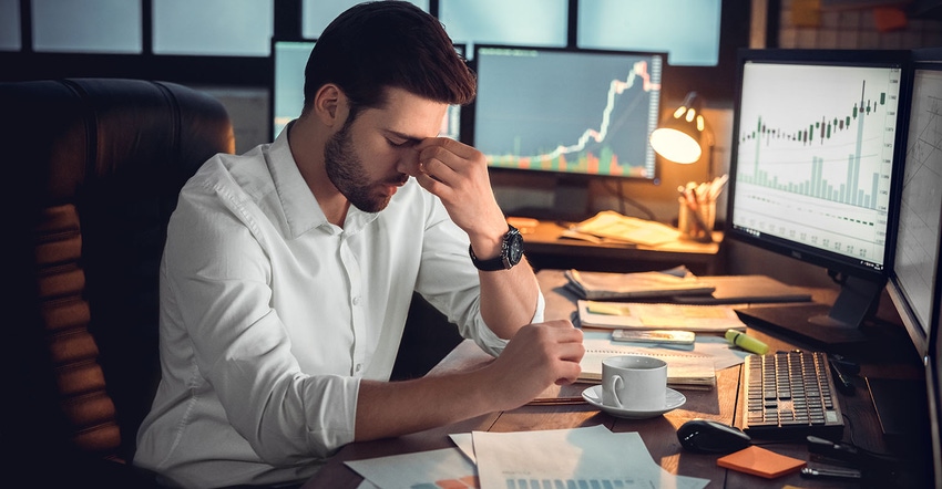 Depressed frustrated trader tired of overwork or stressed by bankruptcy, sad shocked investor desperate about financial crisi