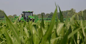 John Deere sprayer in cornfield