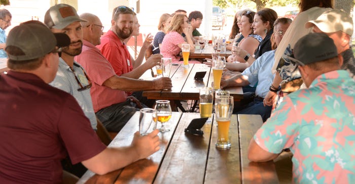 Cultivating Master Farmers Class of 2023 socializing at Riggs Beer Co,