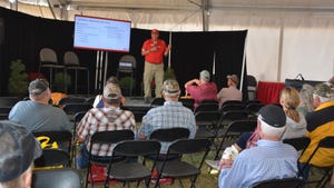 Speaker at Husker Harvest Days speaking to attendees at the Hospitality Tent