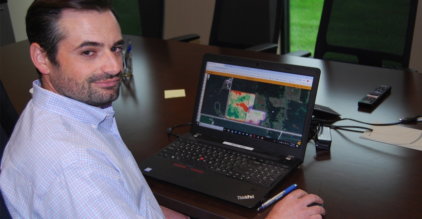 Ben Johnson with laptop showing field mapping