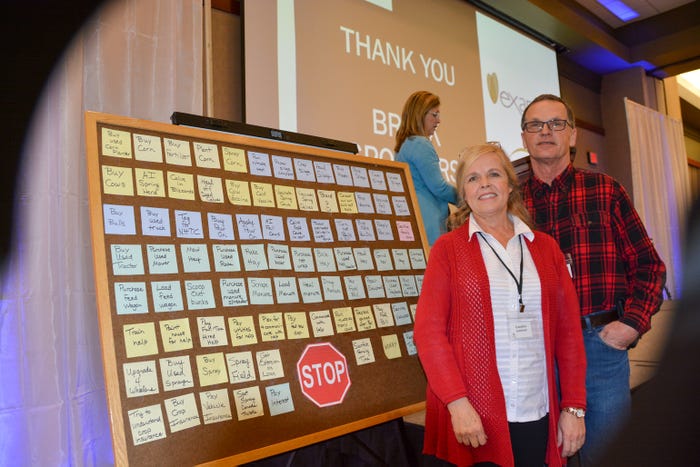 Dean and Candice Lockner standing beside a board filled with post-it notes at the 2020 South Dakota Soil Health Conference