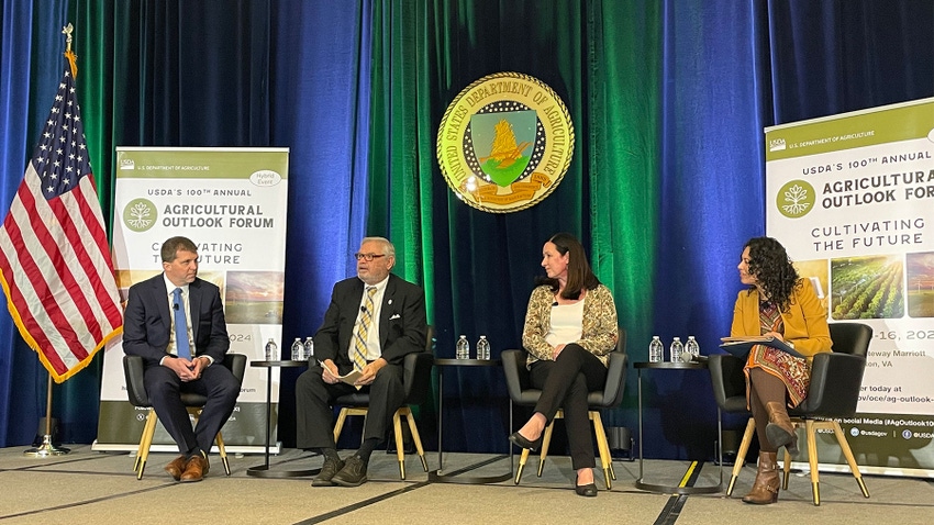 Panelist sit on a stage during USDA’s Ag Outlook Forum in Washington, D.C.