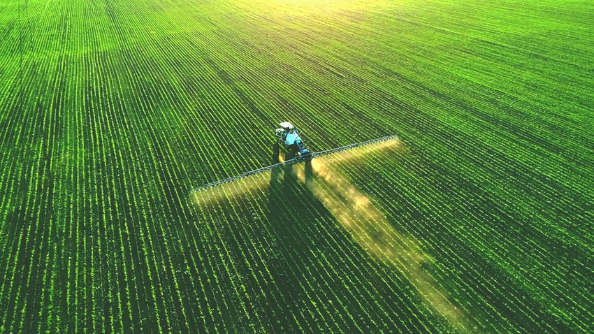 Sprayer in green field Sprayer in green field