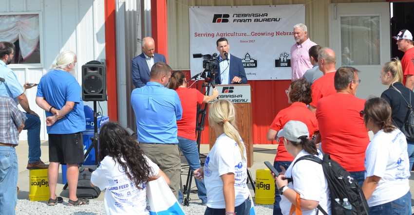 FBI special agent Eugene Kowel (at podium) speaks during a press conference hosted by Nebraska Farm Bureau at Husker Harvest 