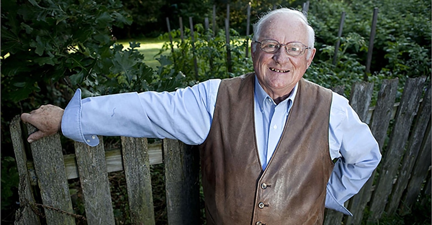 Jerry Apps leaning on a wooden fence in his garden Jerry Apps leaning on a wooden fence in his garden