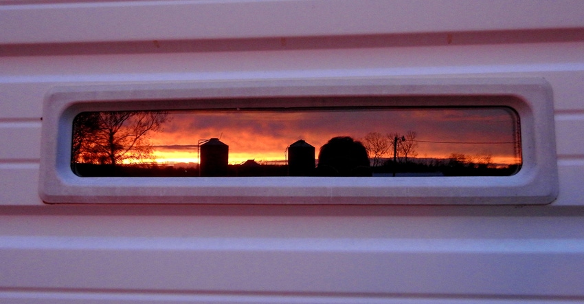 rural landscape reflected in long, narrow window