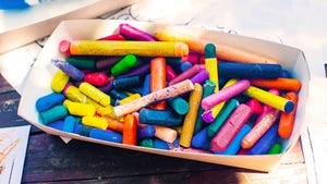 A box of used and broken crayons