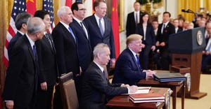 US President Donald Trump and China's Vice Premier Liu He sign a trade agreement.