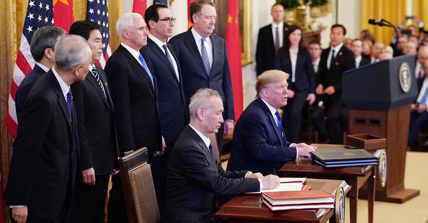 US President Donald Trump and China's Vice Premier Liu He sign a trade agreement. US President Donald Trump and China's Vice Premier Liu He sign a trade agreement.