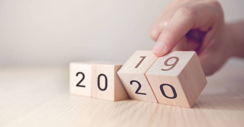 hand changing wooden cubes with year 2019 to 2020