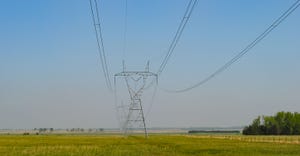 Landscape view of power lines over agricultural fields