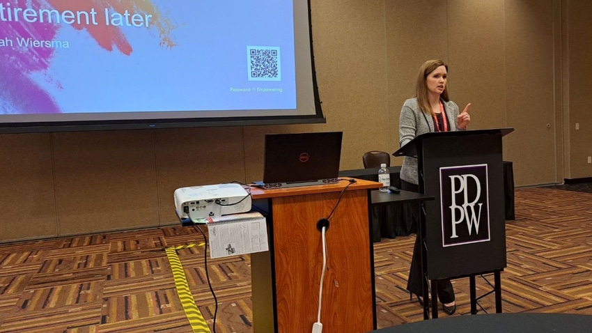 Financial advisor Sarah Wiersma speaking at podium Financial advisor Sarah Wiersma speaking at podium