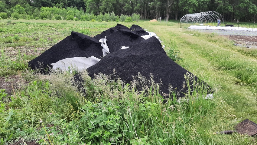 A stockpile of biochar ready to be spread out in field trials