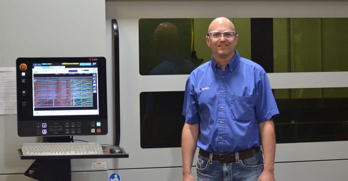 Chris Roth, president at Reinke, standing in front of the new laser production unit 