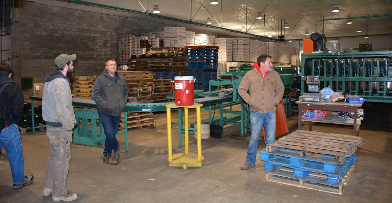 Larchmont Farms works in packing area