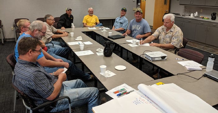 Organizers at the inaugural soil health team meeting in Morris discuss educational outreach to farmers and land owners
