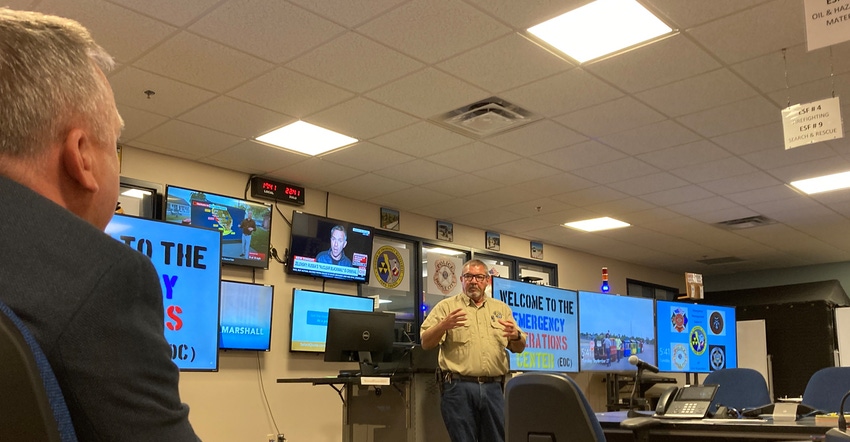 K-State President Richard Linton listens to Ford County Emergency Manager Rex Beemer 