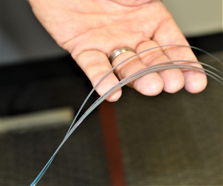 hand with fiberoptic cables