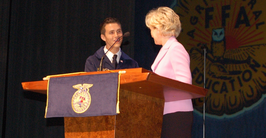 Travis Martin, FFA 2009-2010 president, greets Becky Skillman, then Lt. Governor, at the 2010 state convention at Purdue Univ