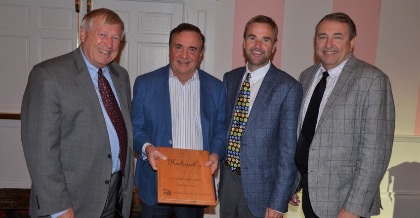 MABA President Jim Byrum awards, from left, Stephen, Herb and Greg Herbruck with the 2019 Leaders and Legends award. 
