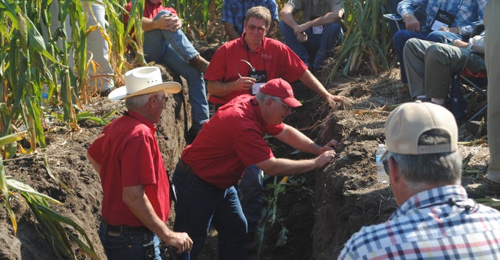 Farmers in a soil pit