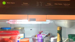  A close-up of an open refrigerator showing the recommended temperature setting