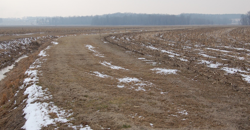 ditch at edge of winter farm field with a filter strip in between ditch at edge of winter farm field with a filter strip in between