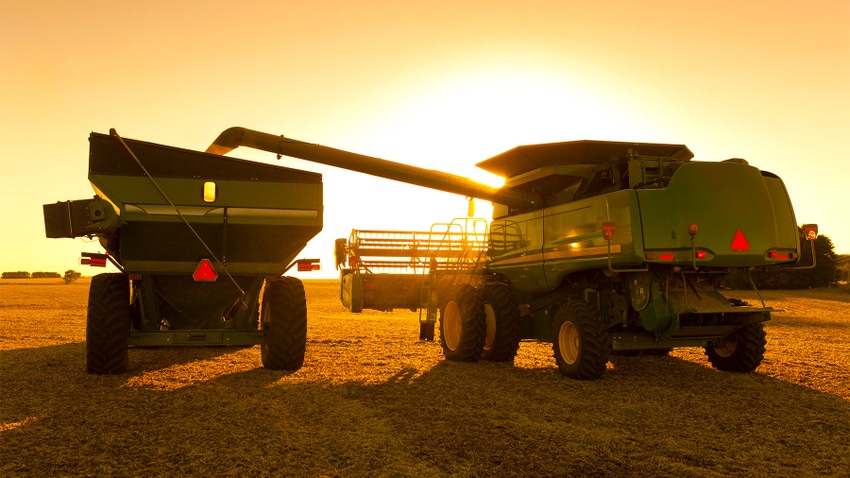 Combine and grain wagon harvesting crop