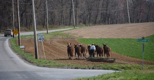 A farmer just south of Strasburg, Pa., works the ground with a team of horses