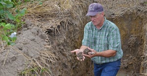 Barry Fisher assesses improvements in soil structure in a crop field