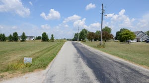 two-lane road through rural area