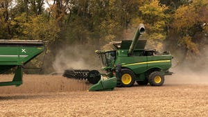 Combine harvesting a soybean field