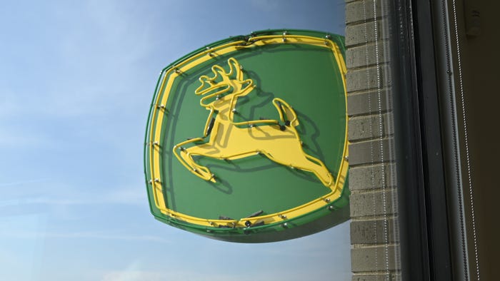 John Deere neon sign on the outside of their Austin, Texas office